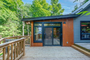 Checking a backyard deck as part of a seasonal home maintenance checklist